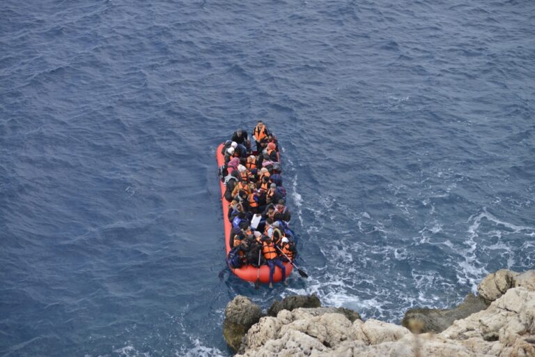 crowded inflatable boat on rough waters